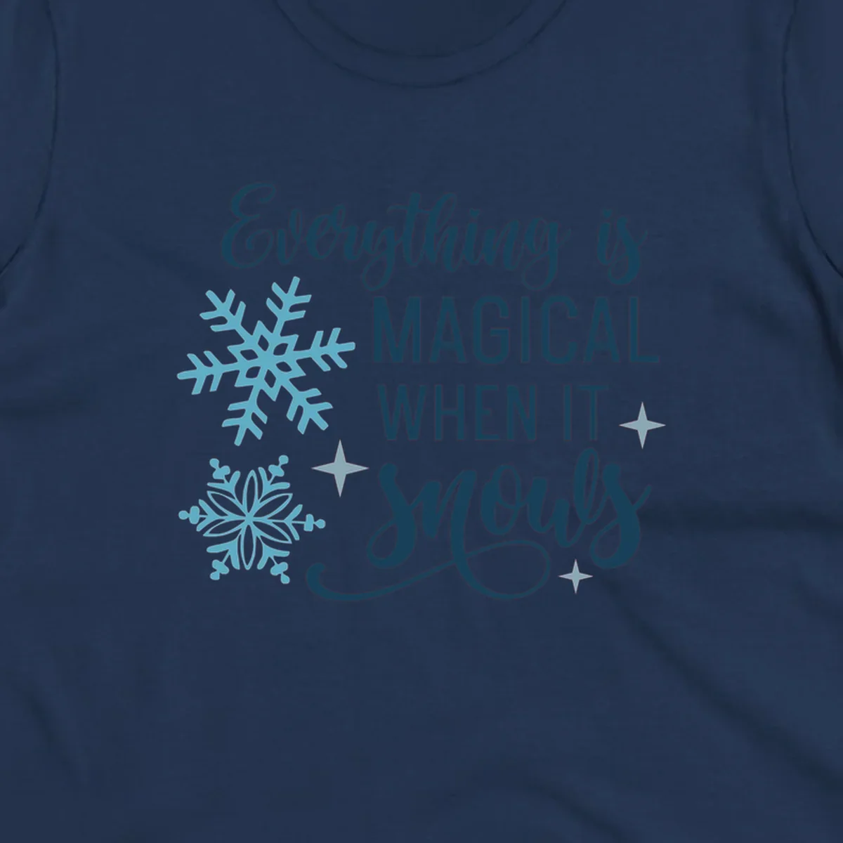 Everything is Magical When It Snows typography with snowflakes and stars.