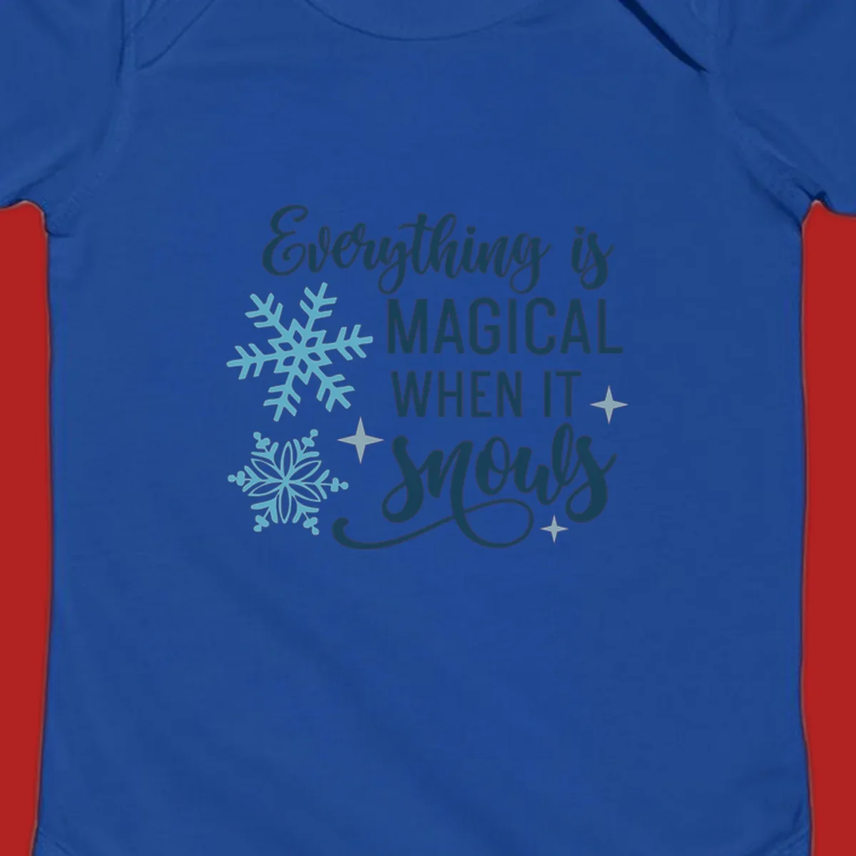Everything is Magical When It Snows typography with snowflakes and stars.