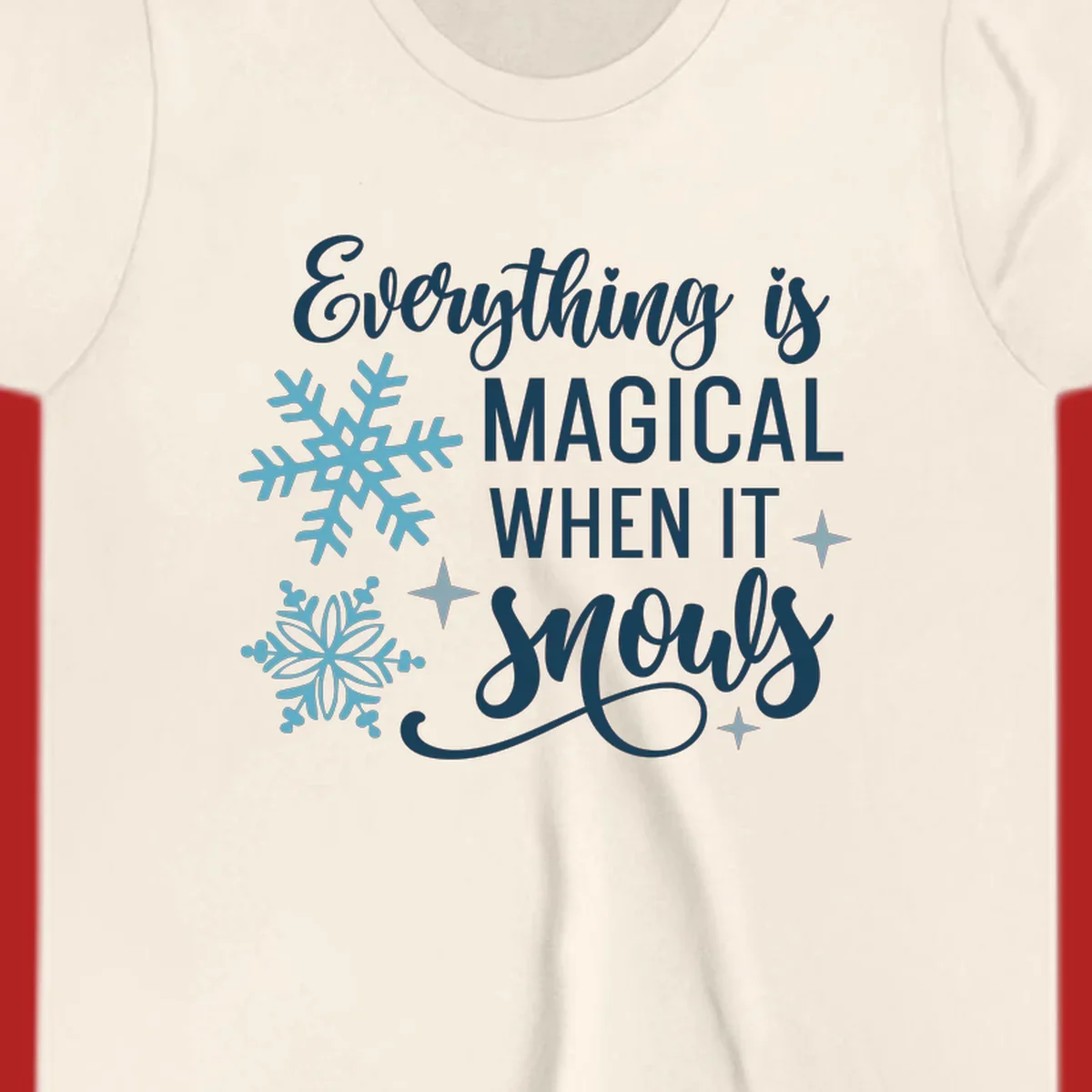Everything is Magical When It Snows typography with snowflakes and stars.