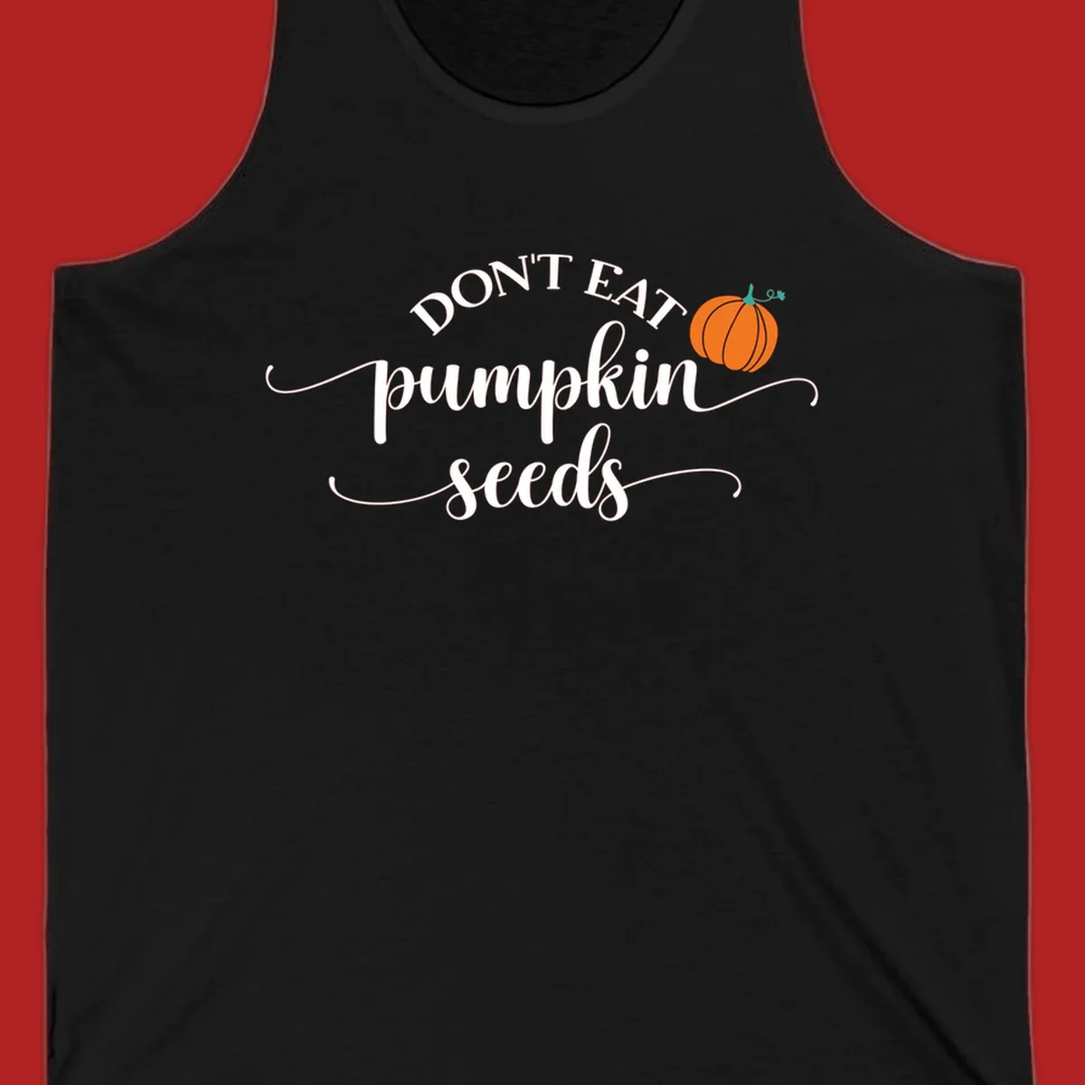 Don't Eat Pumpkin Seeds fall phrase with pumpkin illustration.