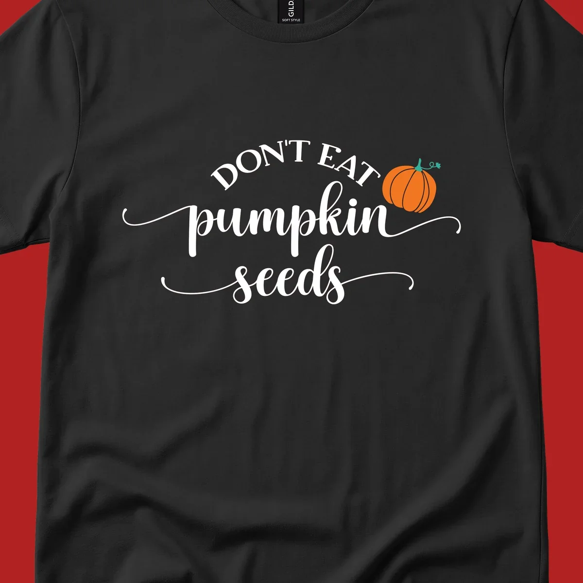 Don't Eat Pumpkin Seeds fall phrase with pumpkin illustration.
