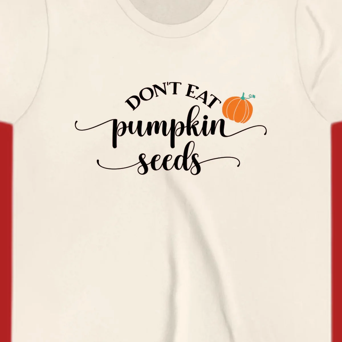 Don't Eat Pumpkin Seeds fall phrase with pumpkin illustration.