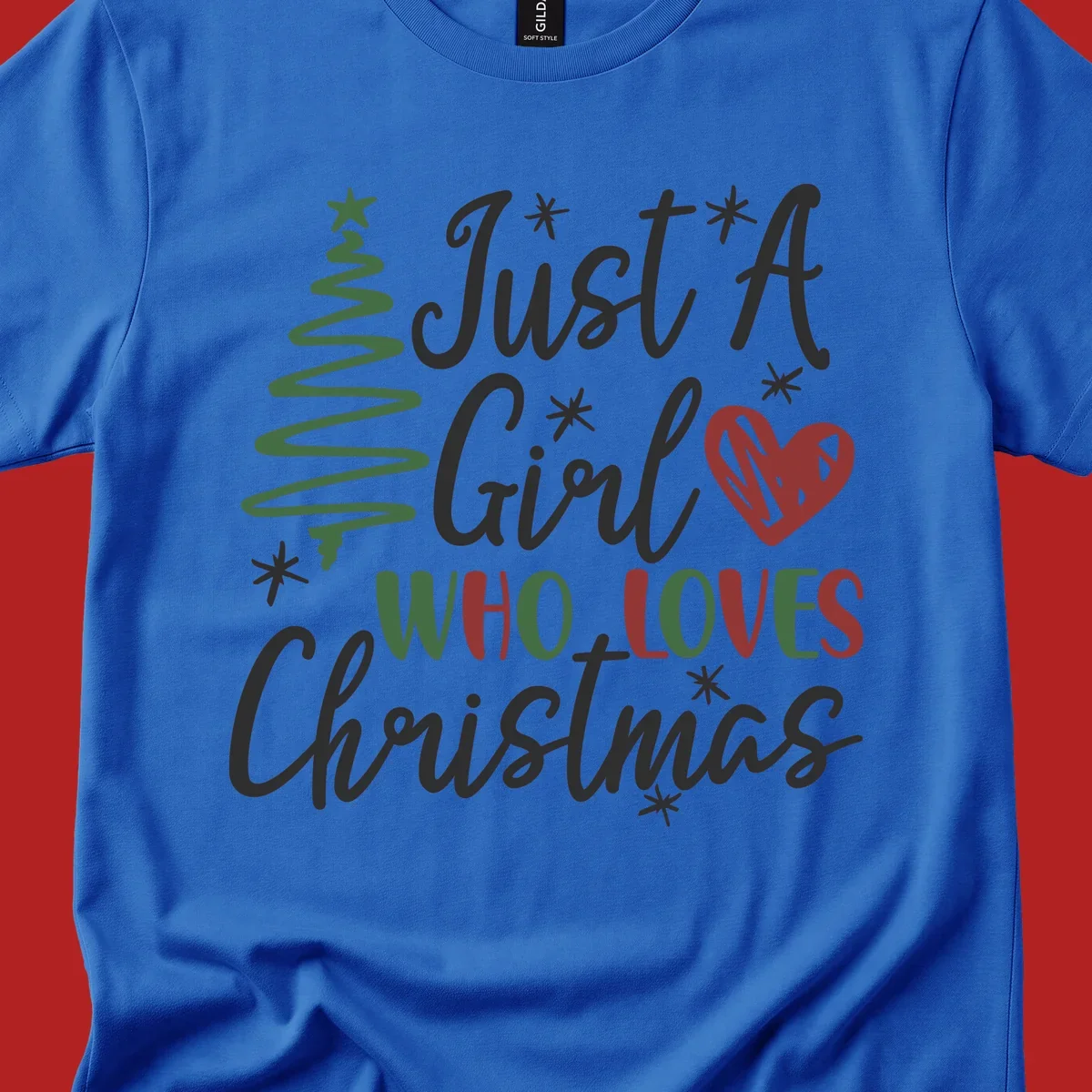Girl who loves Christmas typography with tree and heart graphic.