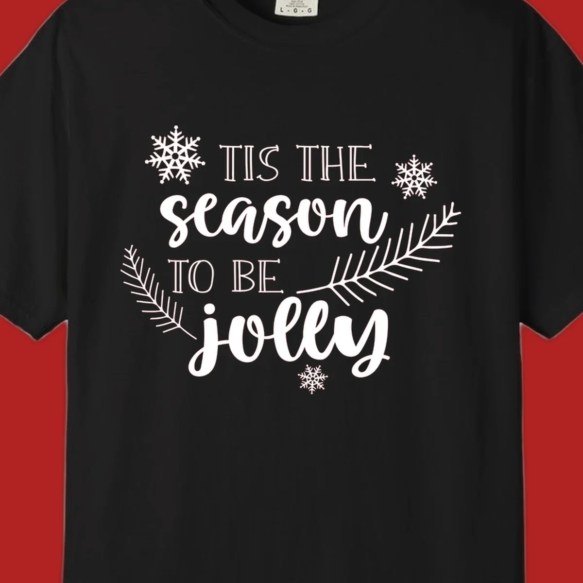 Tis the season to be jolly Christmas design with snowflakes and pine branches.