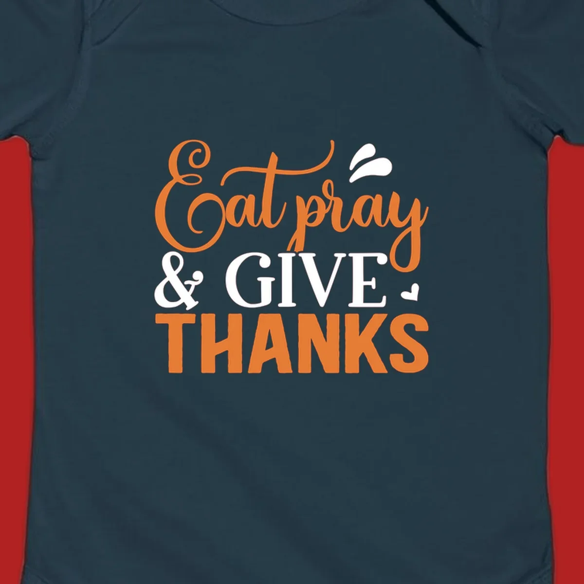 Eat Pray Give Thanks text design with orange, white, and black lettering.