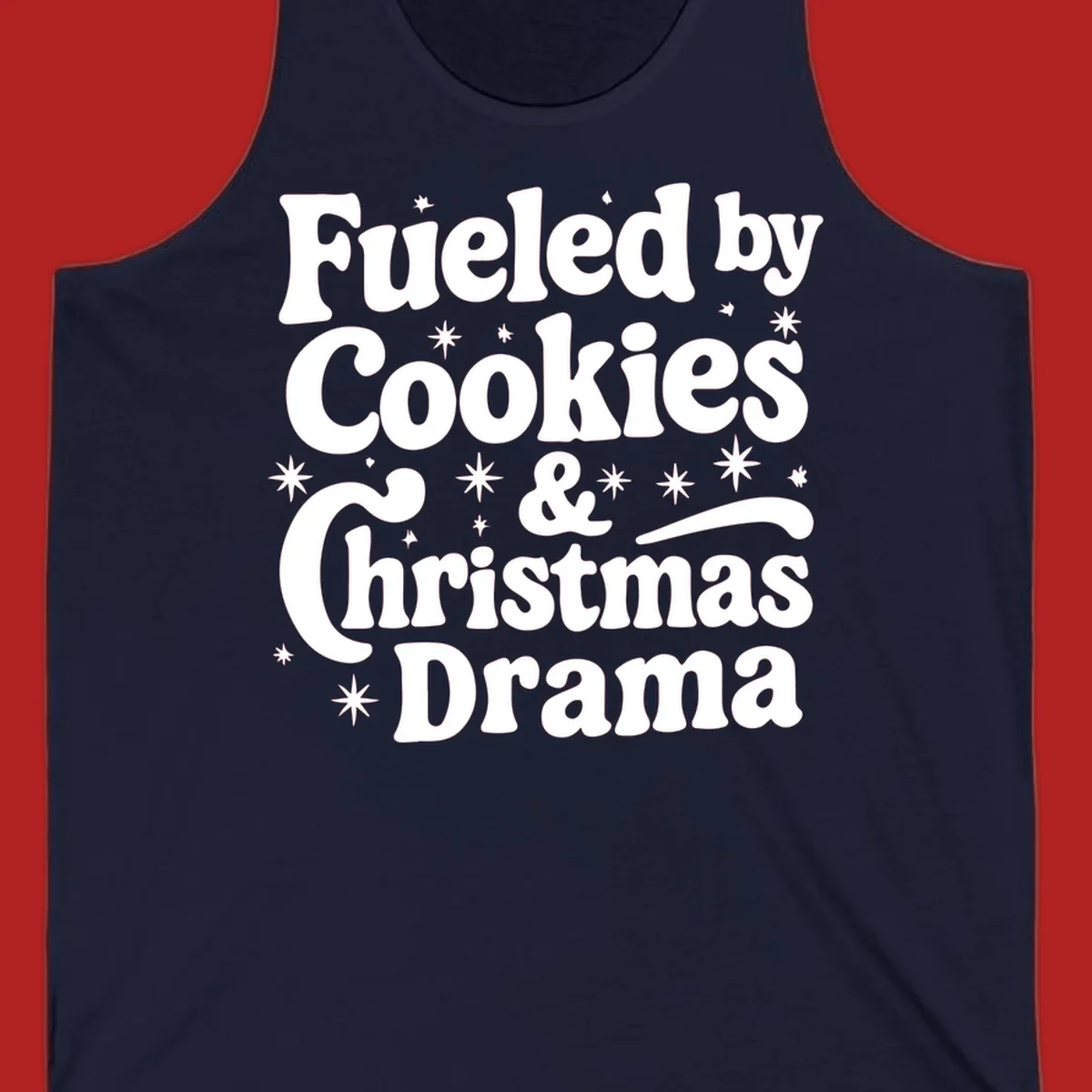 Text design 'Fueled by Cookies & Christmas Drama' with stars, for Christmas.