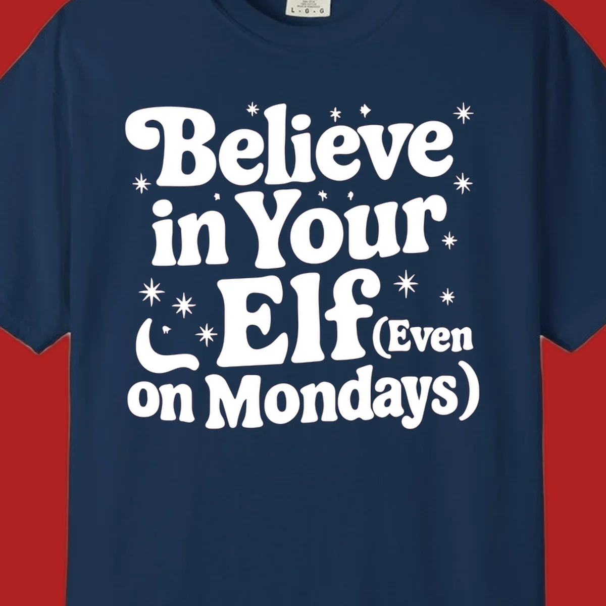 Believe in Your Elf text with stars and sparkles, retro font.