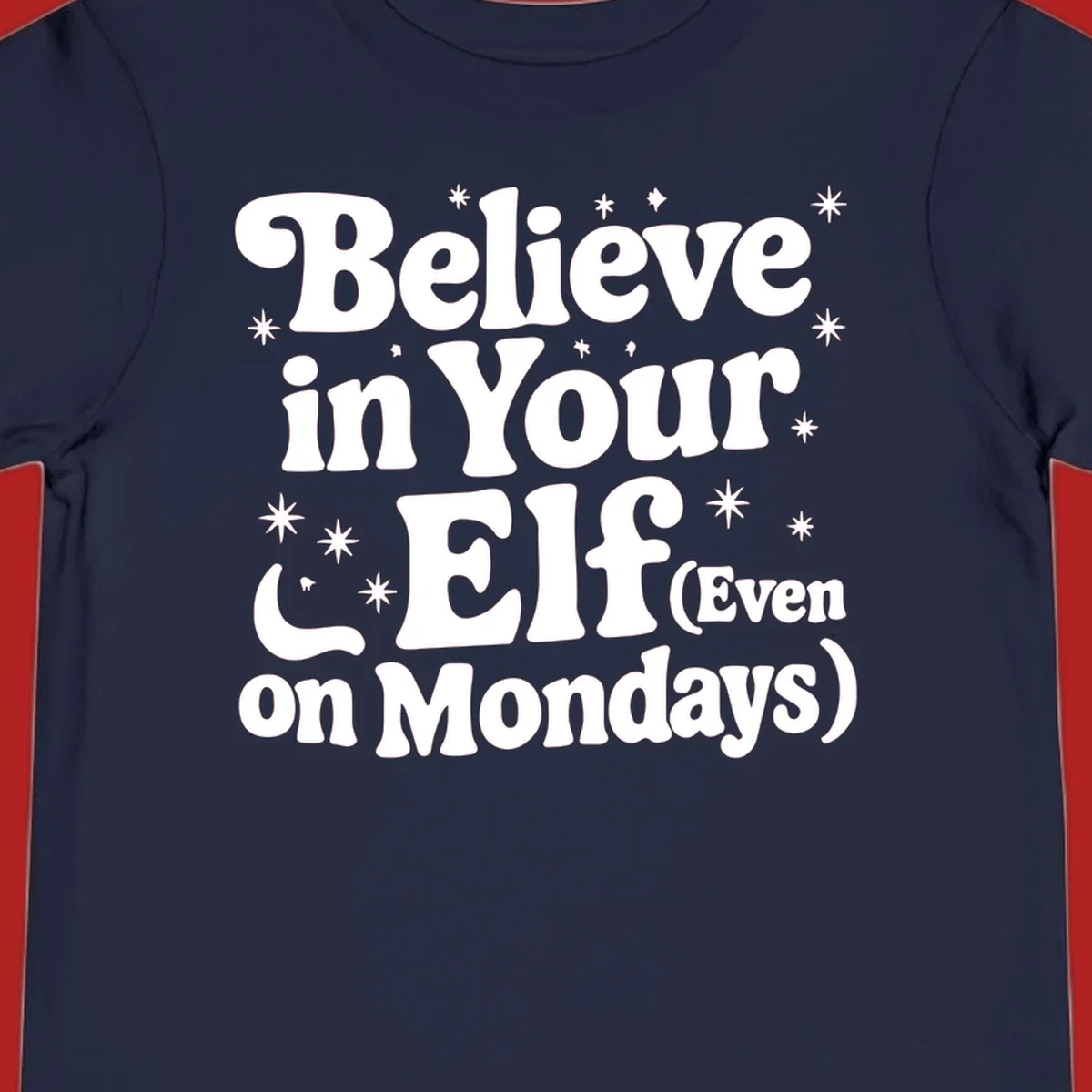Believe in Your Elf text with stars and sparkles, retro font.