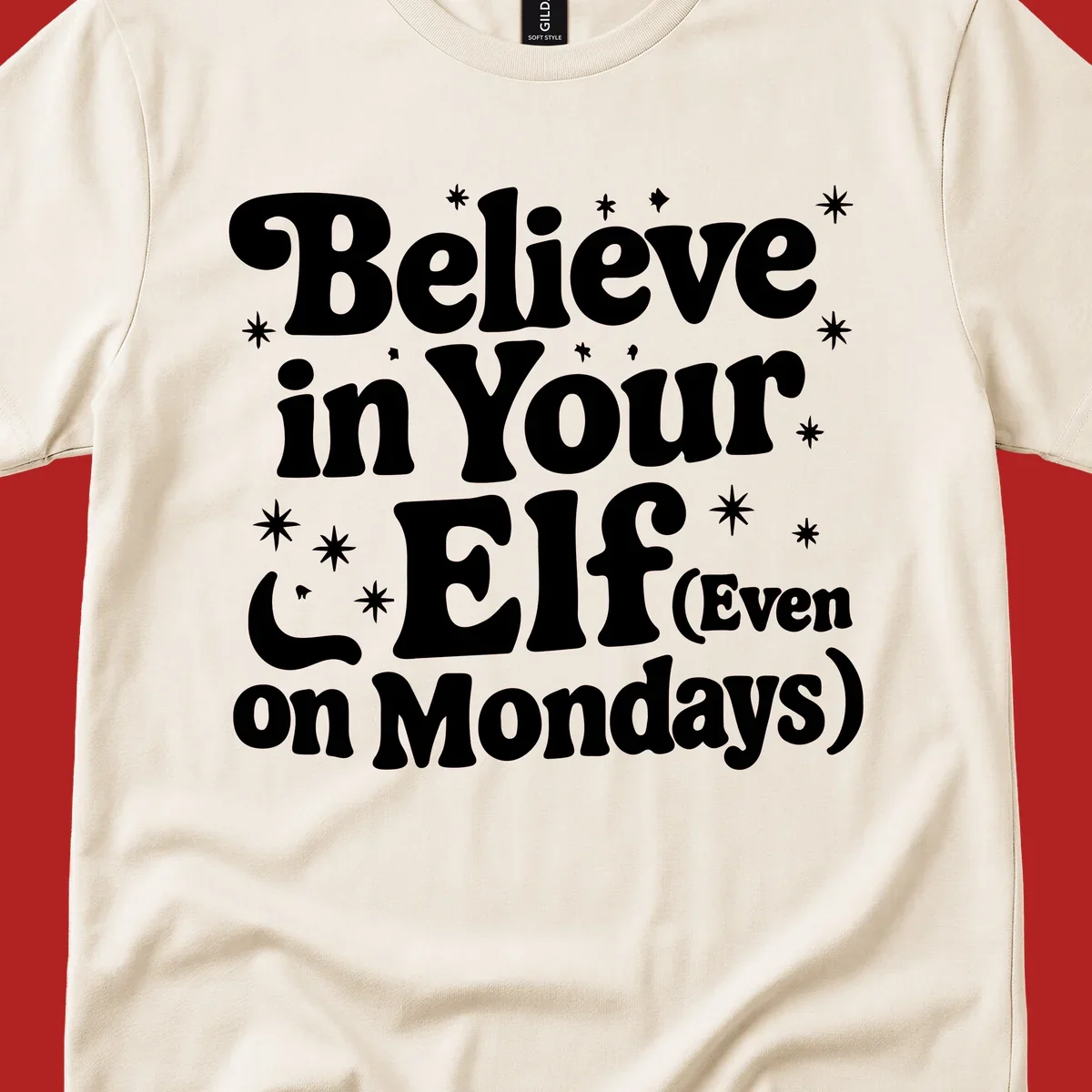 Believe in Your Elf text with stars and sparkles, retro font.