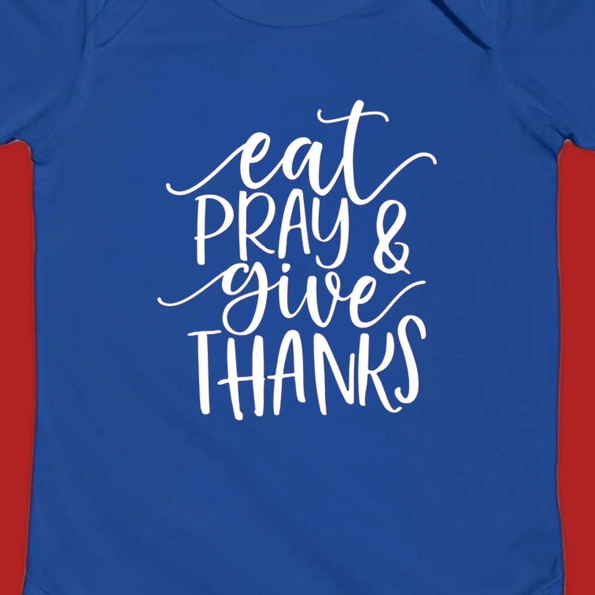 Eat Pray Give Thanks hand-lettered design with white text on a dark background.