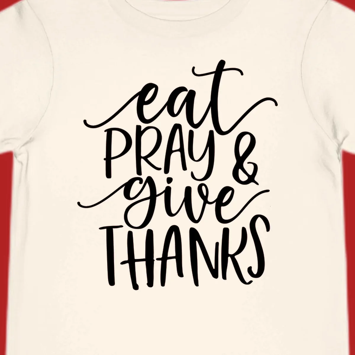 Eat Pray Give Thanks hand-lettered design with white text on a dark background.