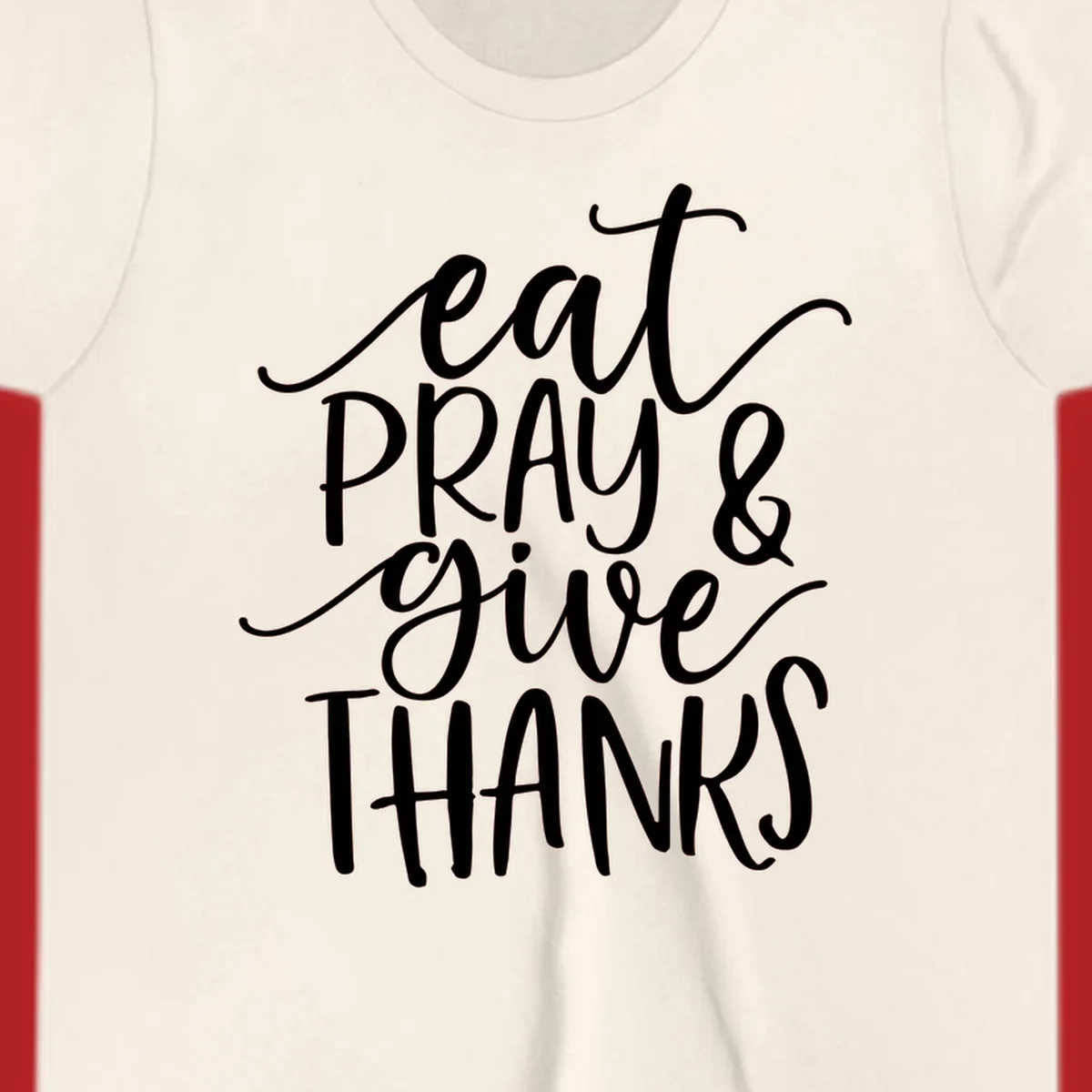 Eat Pray Give Thanks hand-lettered design with white text on a dark background.