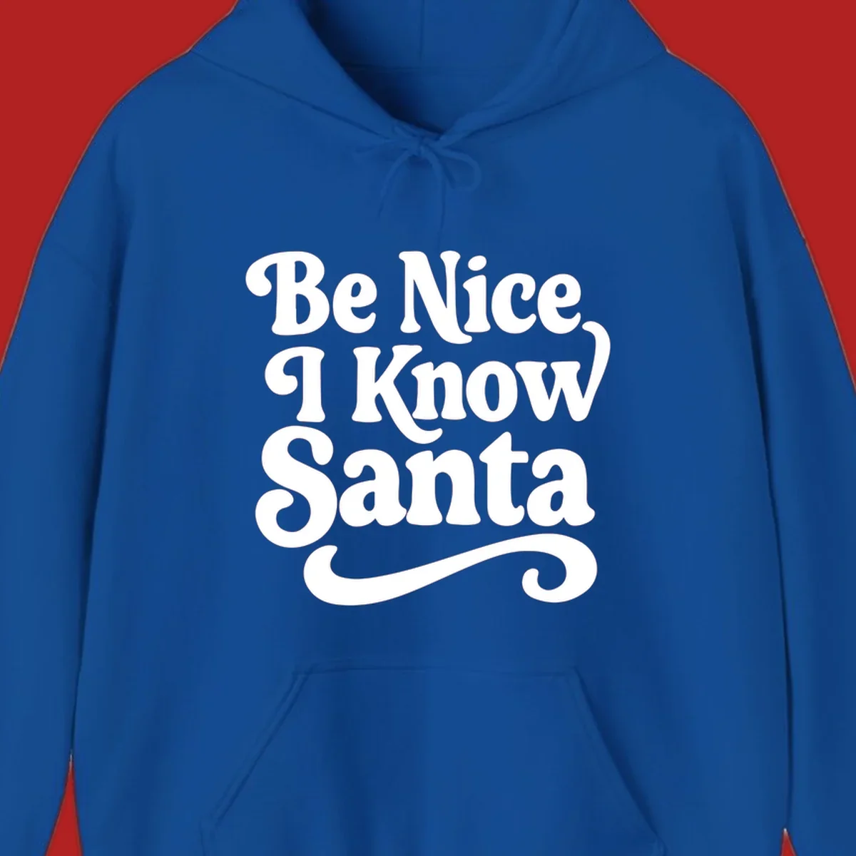 White retro text 'Be Nice I Know Santa' with a flourish, holiday design.