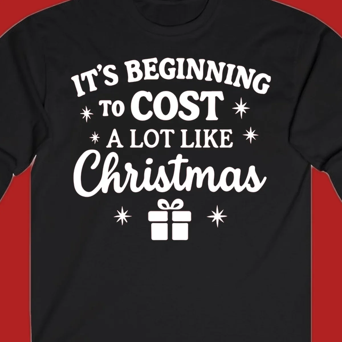 Typography design that says "It's Beginning To Cost A Lot Like Christmas" with stars and a gift box.