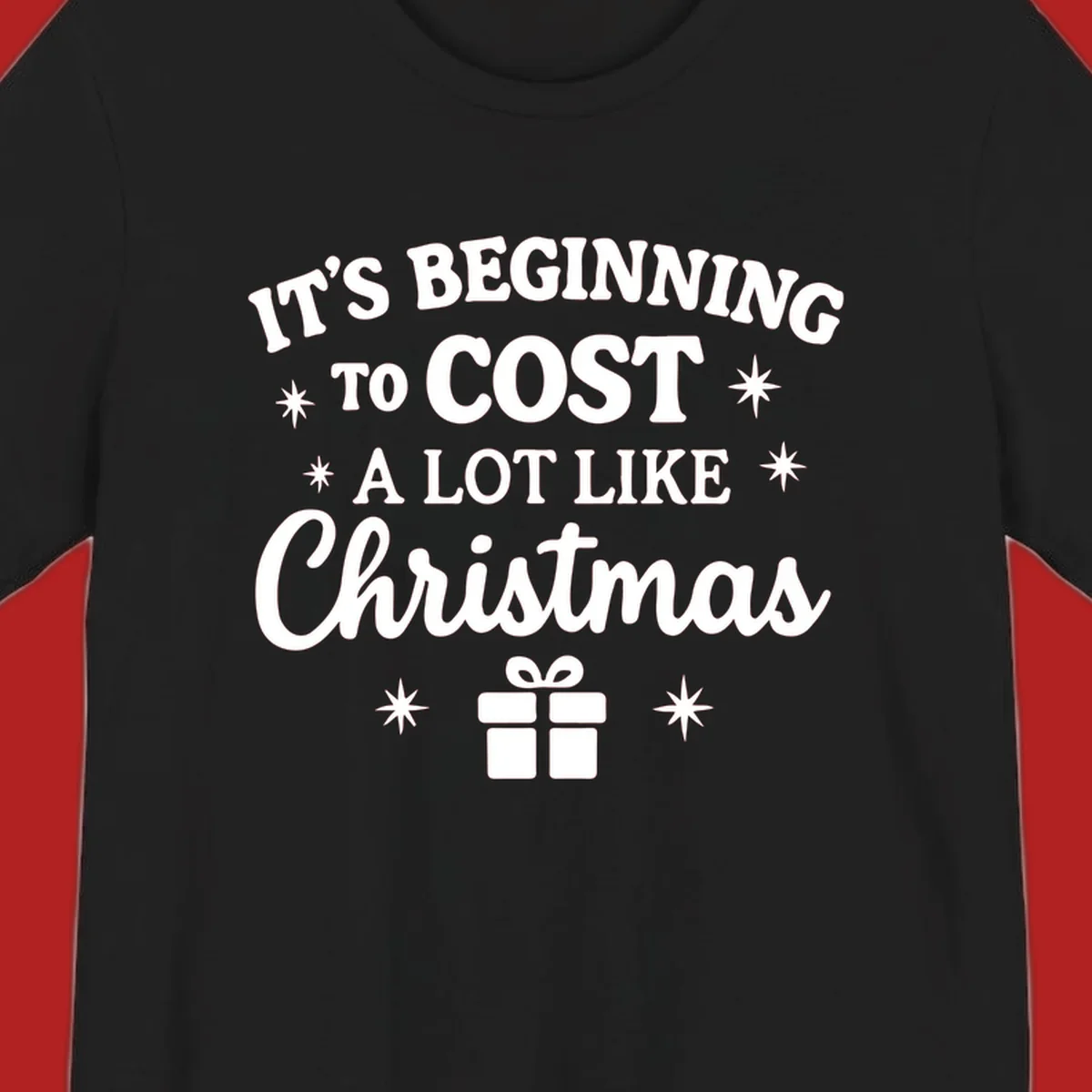 Typography design that says "It's Beginning To Cost A Lot Like Christmas" with stars and a gift box.