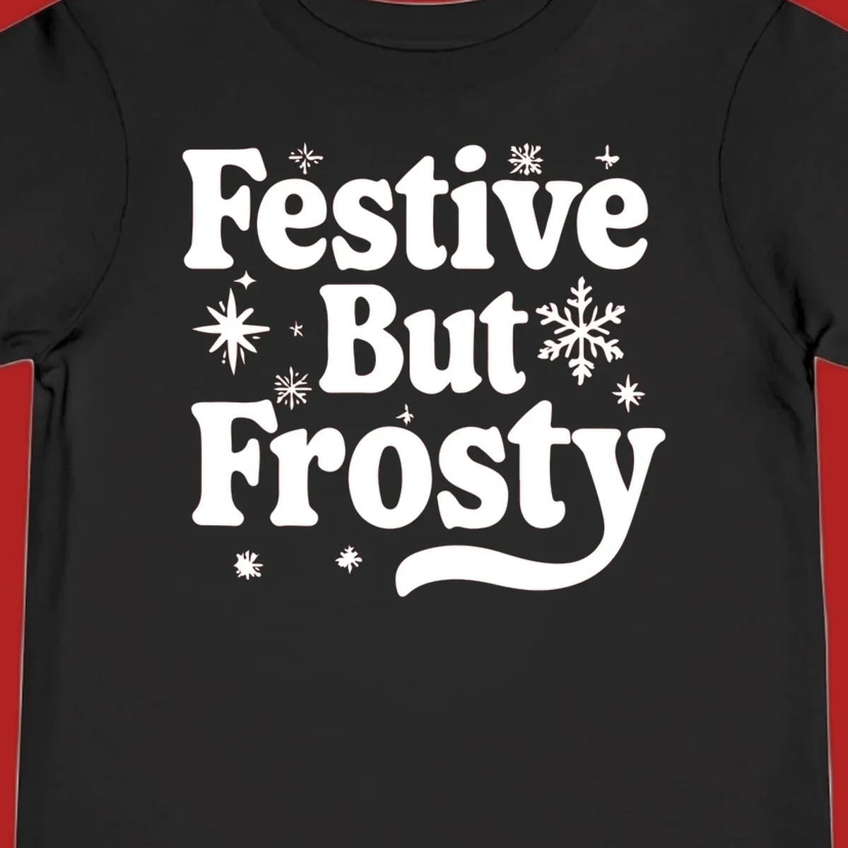Festive But Frosty text with snowflakes and stars, holiday design.