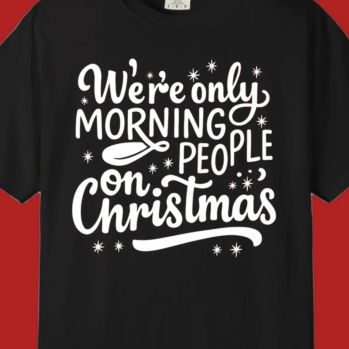 White text that says We're only MORNING PEOPLE on Christmas, with stars and a spoon.