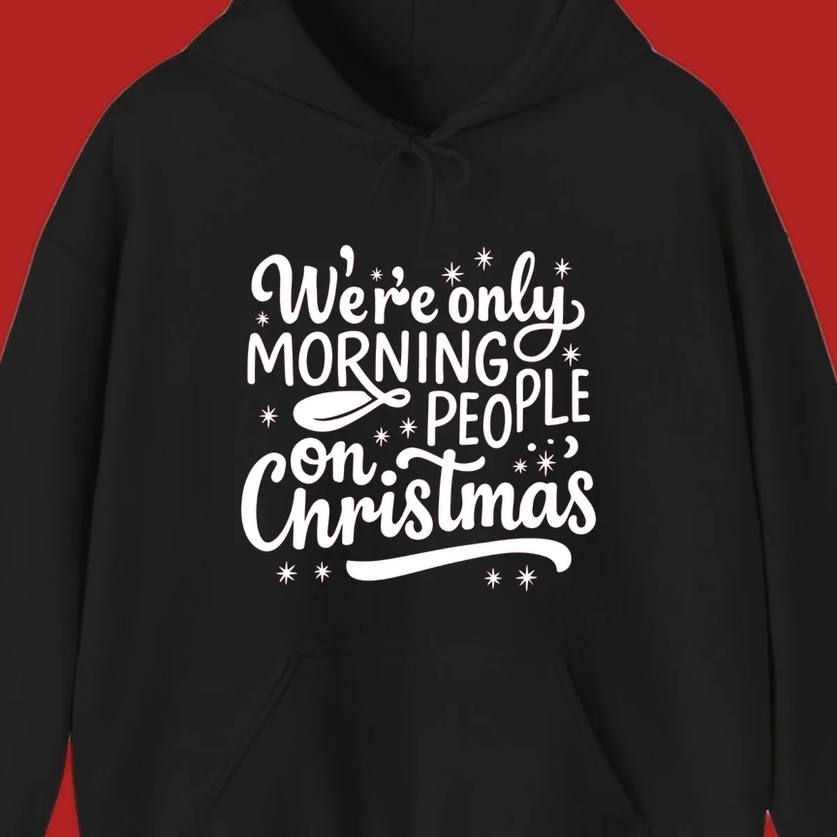 White text that says We're only MORNING PEOPLE on Christmas, with stars and a spoon.