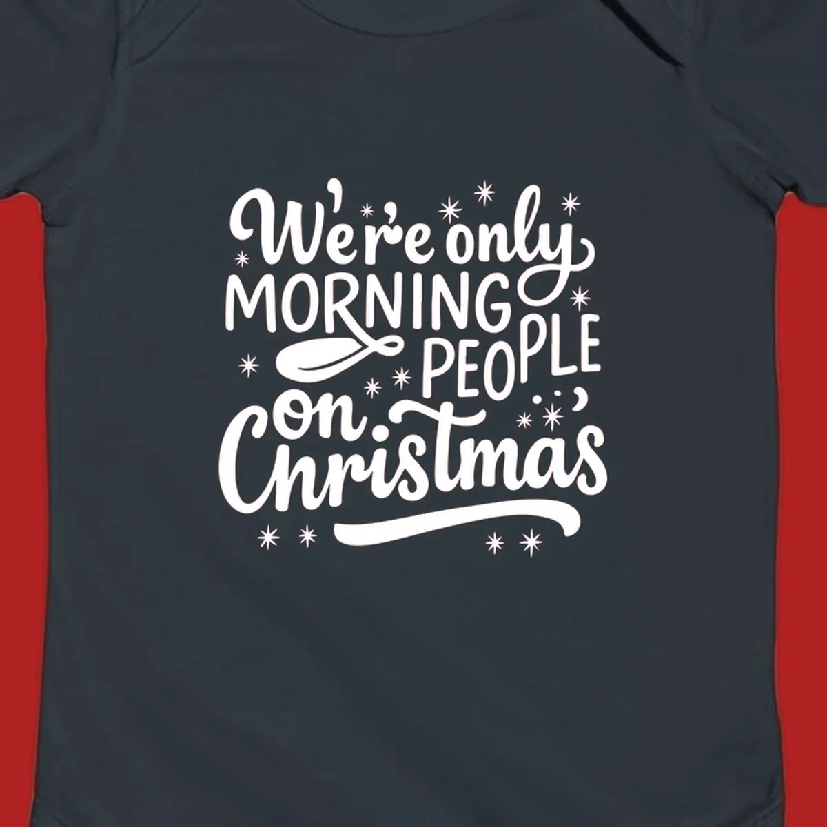 White text that says We're only MORNING PEOPLE on Christmas, with stars and a spoon.