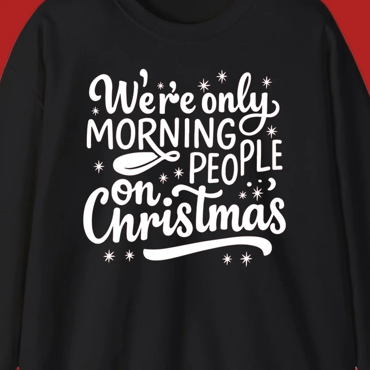 White text that says We're only MORNING PEOPLE on Christmas, with stars and a spoon.