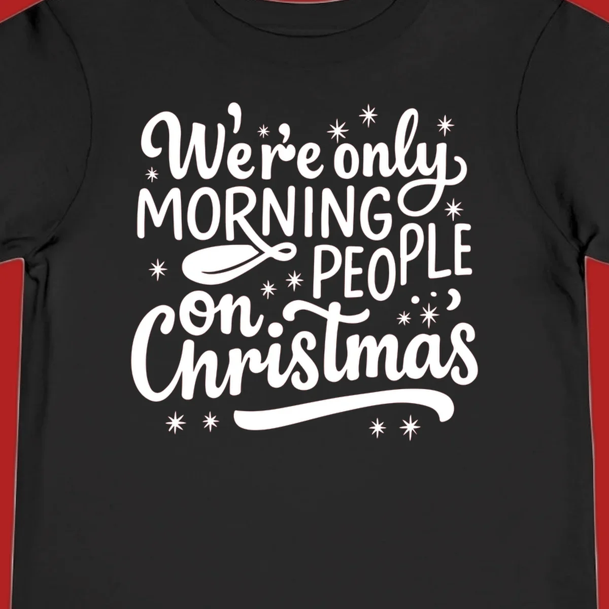 White text that says We're only MORNING PEOPLE on Christmas, with stars and a spoon.
