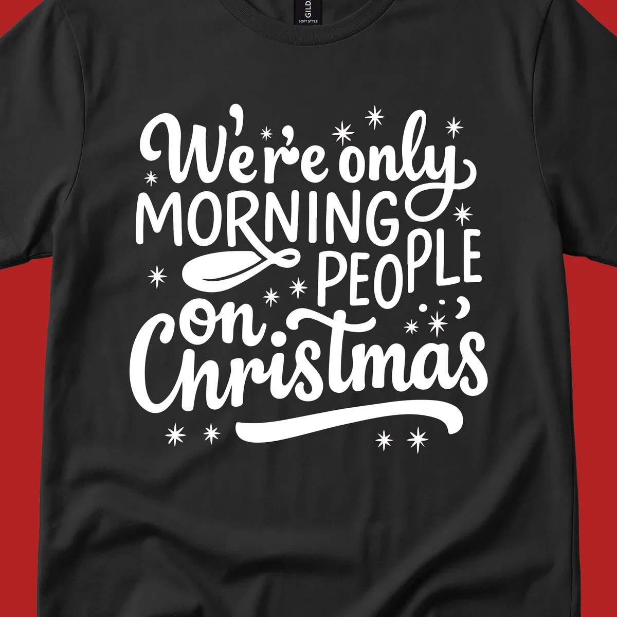 White text that says We're only MORNING PEOPLE on Christmas, with stars and a spoon.