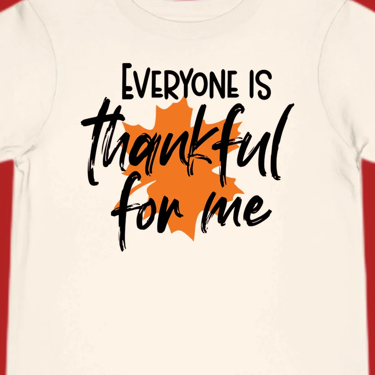 Text that reads "EVERYONE IS thankful for me" over an orange maple leaf. thankful-for-me design.