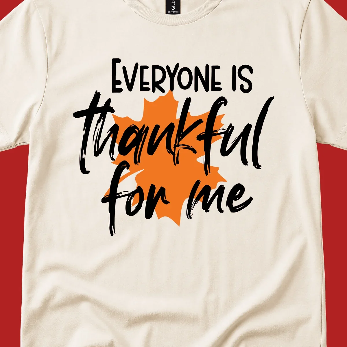 Text that reads "EVERYONE IS thankful for me" over an orange maple leaf. thankful-for-me design.