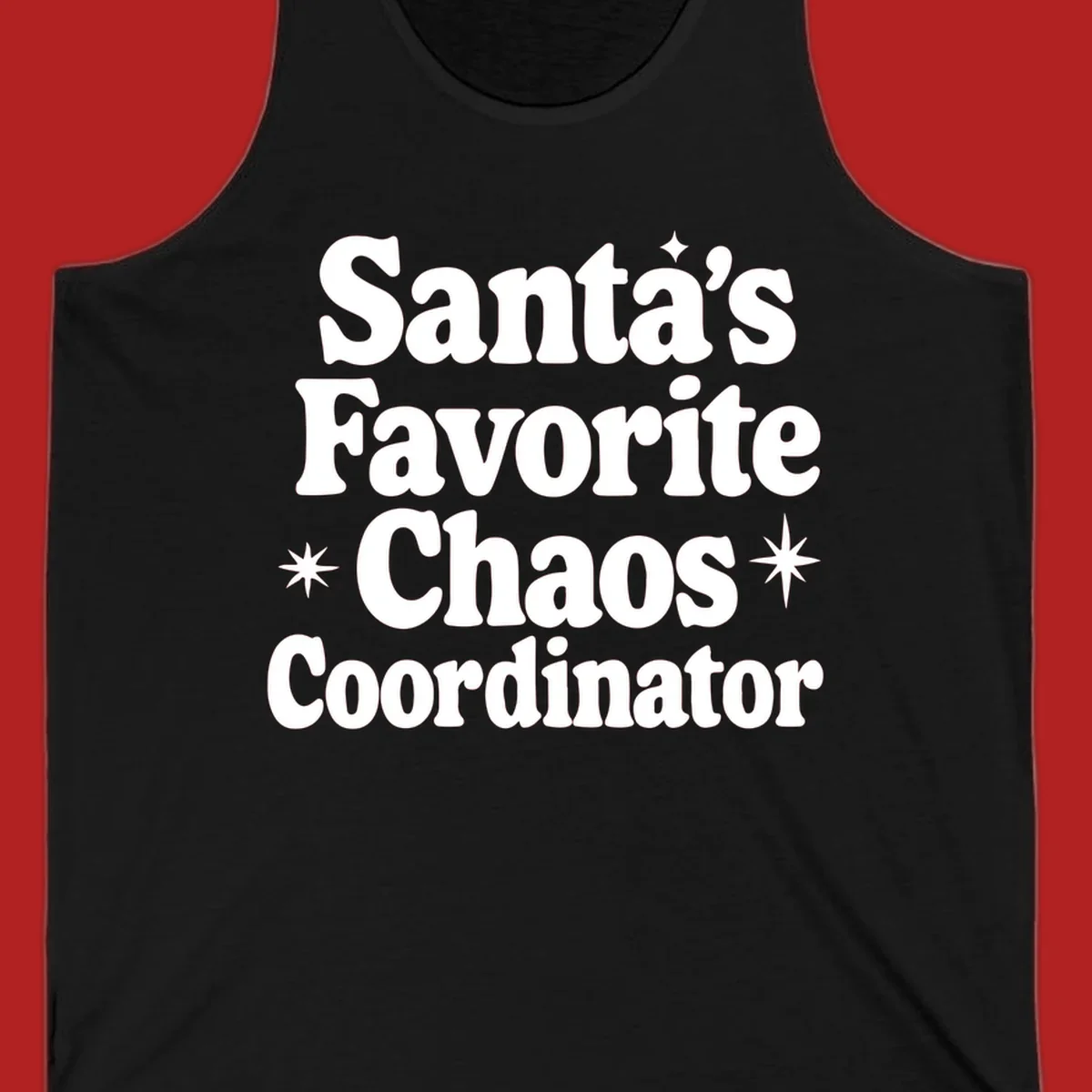 White retro typography reads 'Santa's Favorite Chaos Coordinator' with star accents.