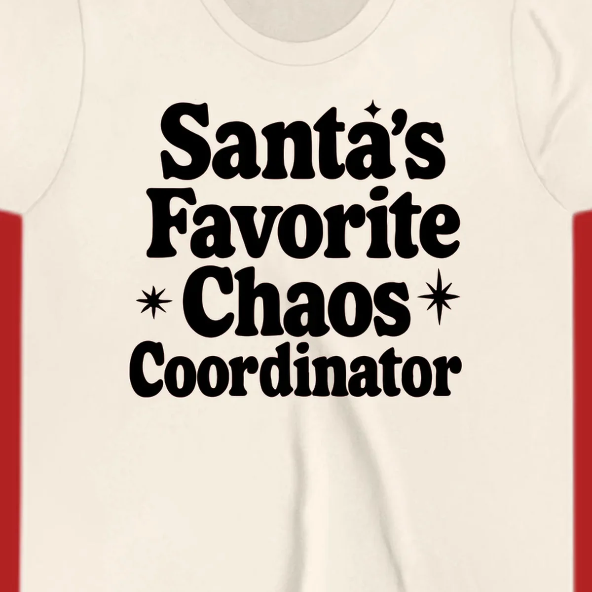 White retro typography reads 'Santa's Favorite Chaos Coordinator' with star accents.