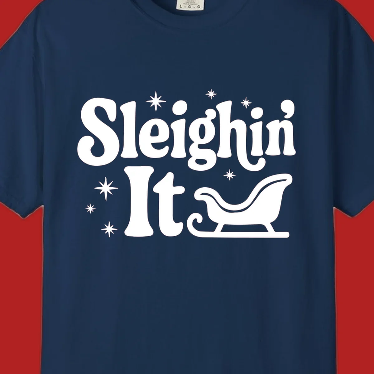 Sleighin It Christmas text and sleigh graphic.