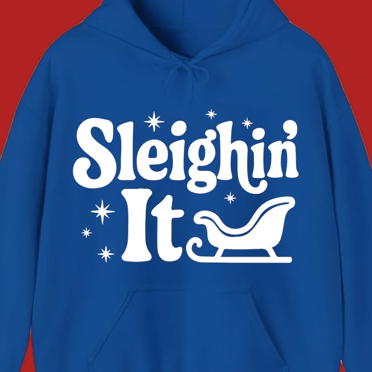 Sleighin It Christmas text and sleigh graphic.