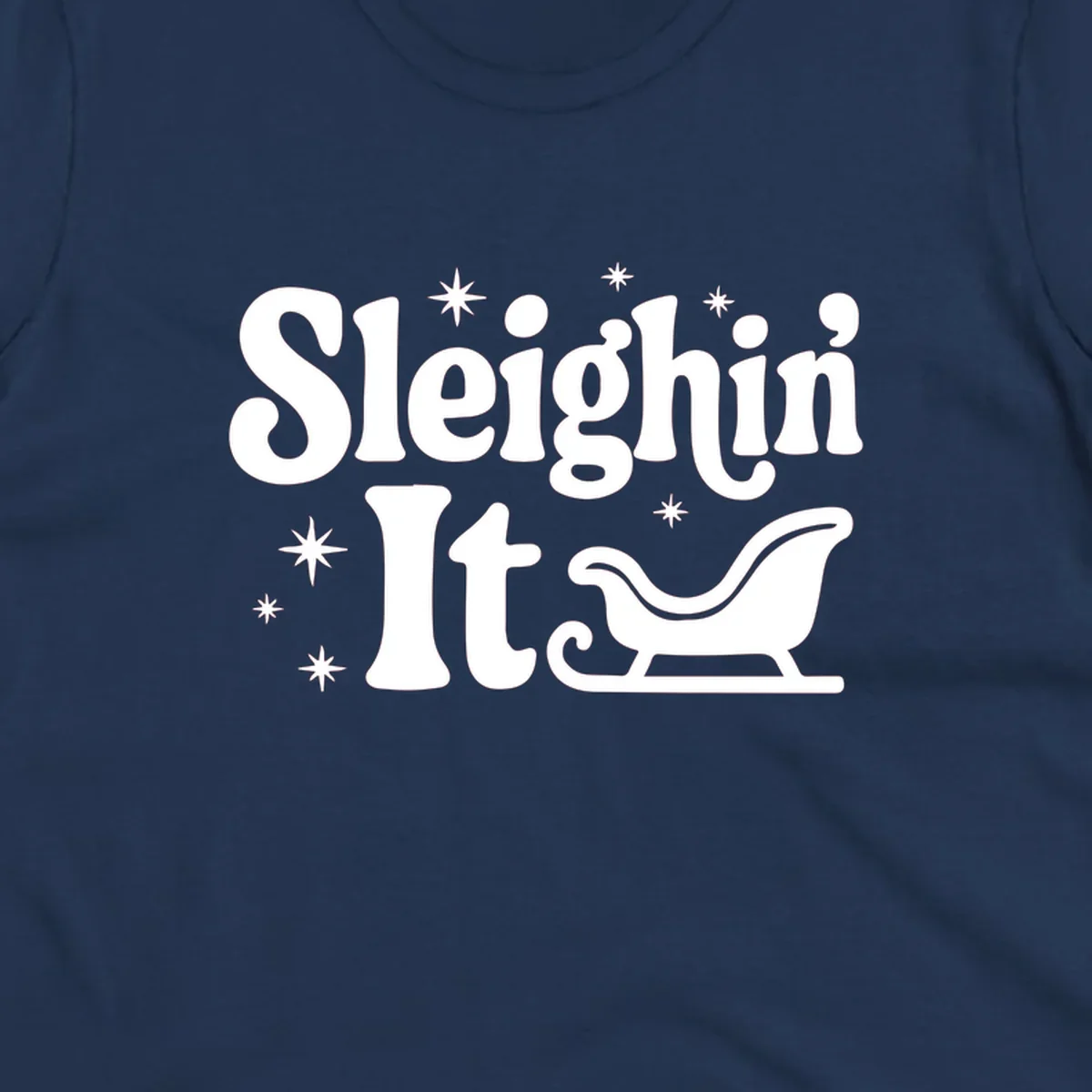 Sleighin It Christmas text and sleigh graphic.