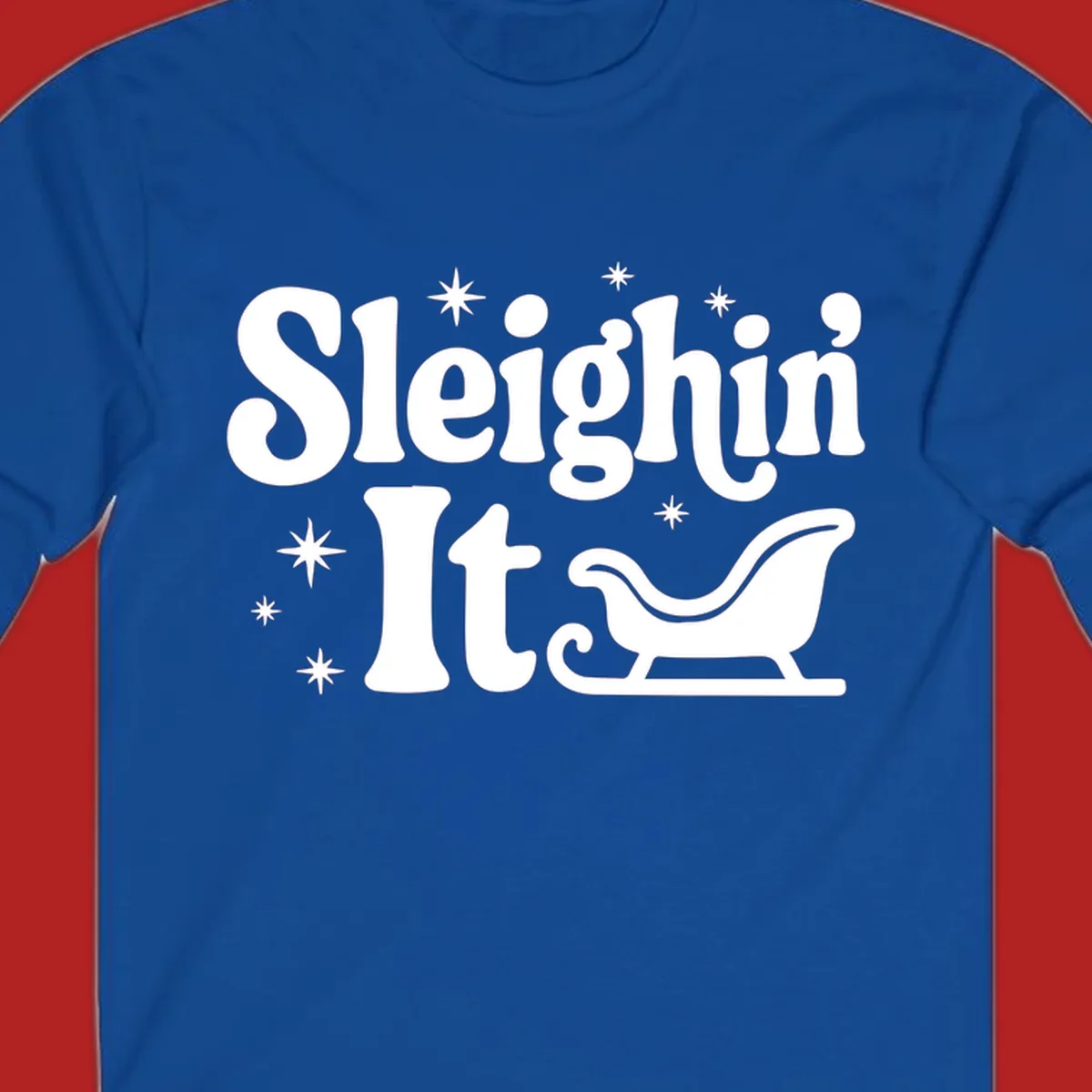 Sleighin It Christmas text and sleigh graphic.