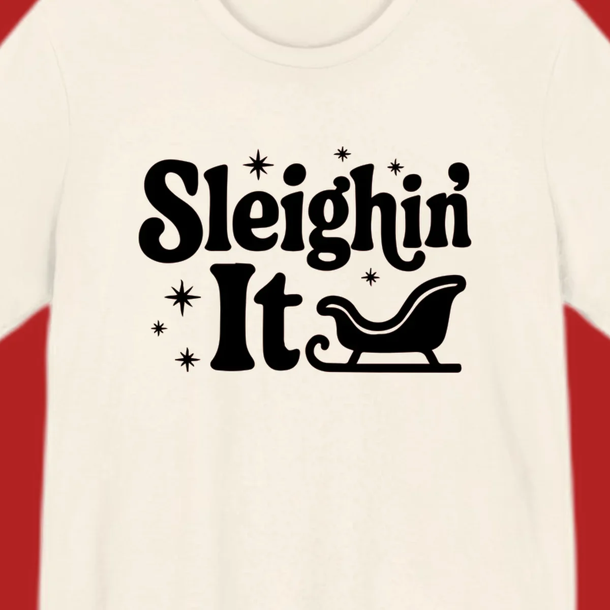 Sleighin It Christmas text and sleigh graphic.