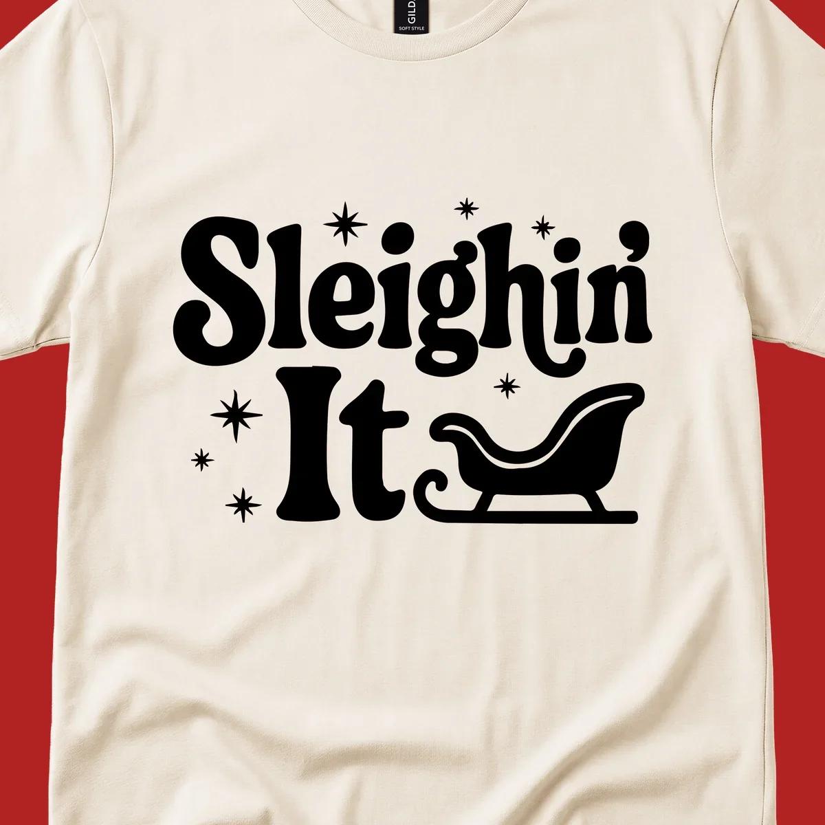 Sleighin It Christmas text and sleigh graphic.