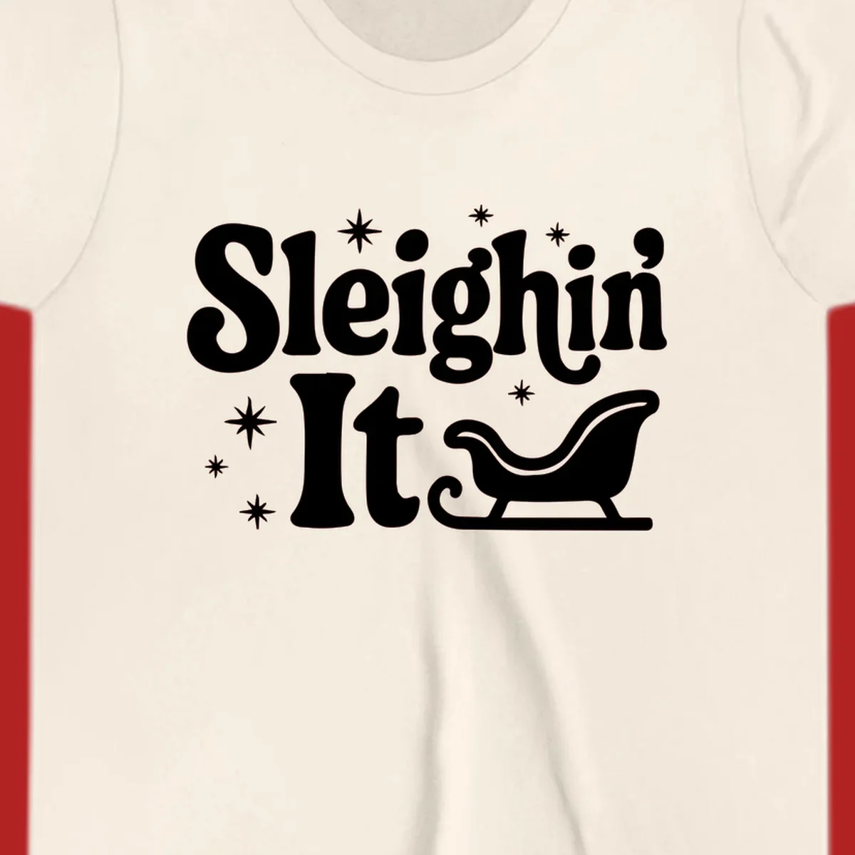 Sleighin It Christmas text and sleigh graphic.