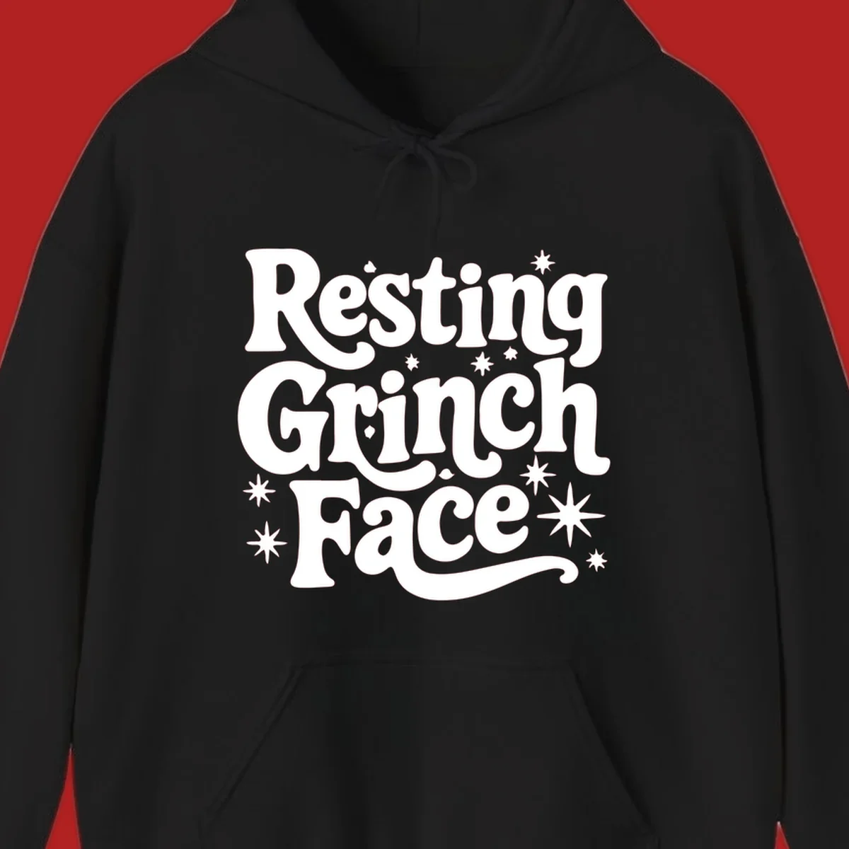 Resting Grinch Face text with stars, holiday design.