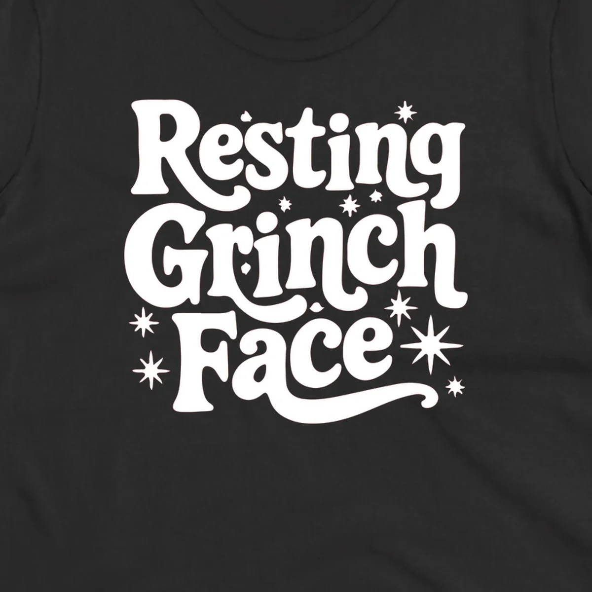 Resting Grinch Face text with stars, holiday design.