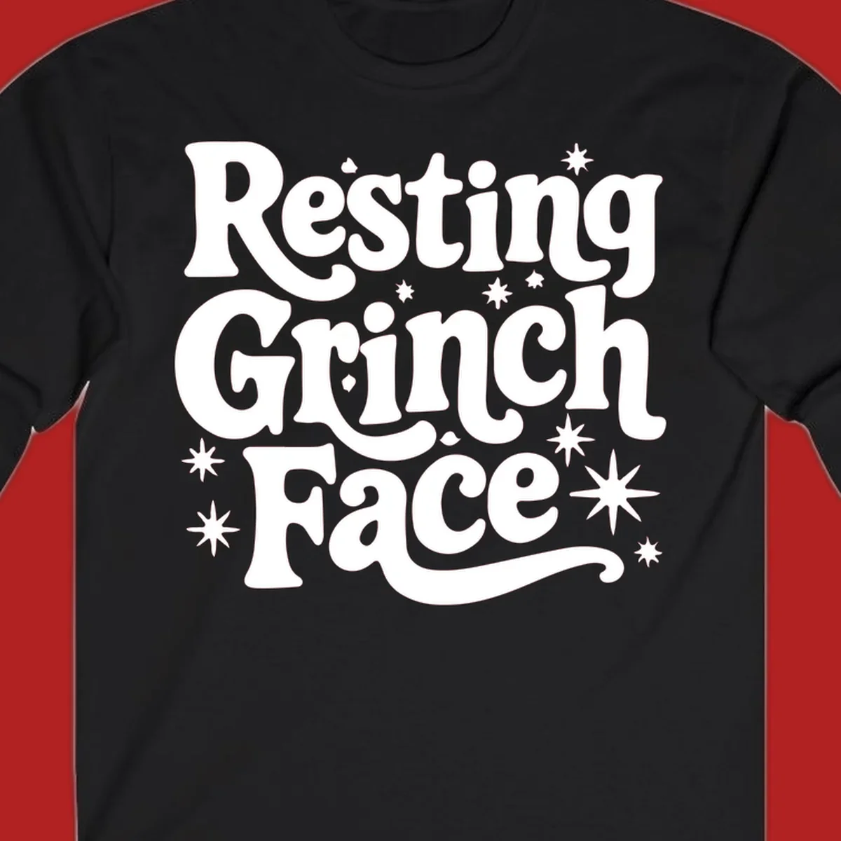 Resting Grinch Face text with stars, holiday design.