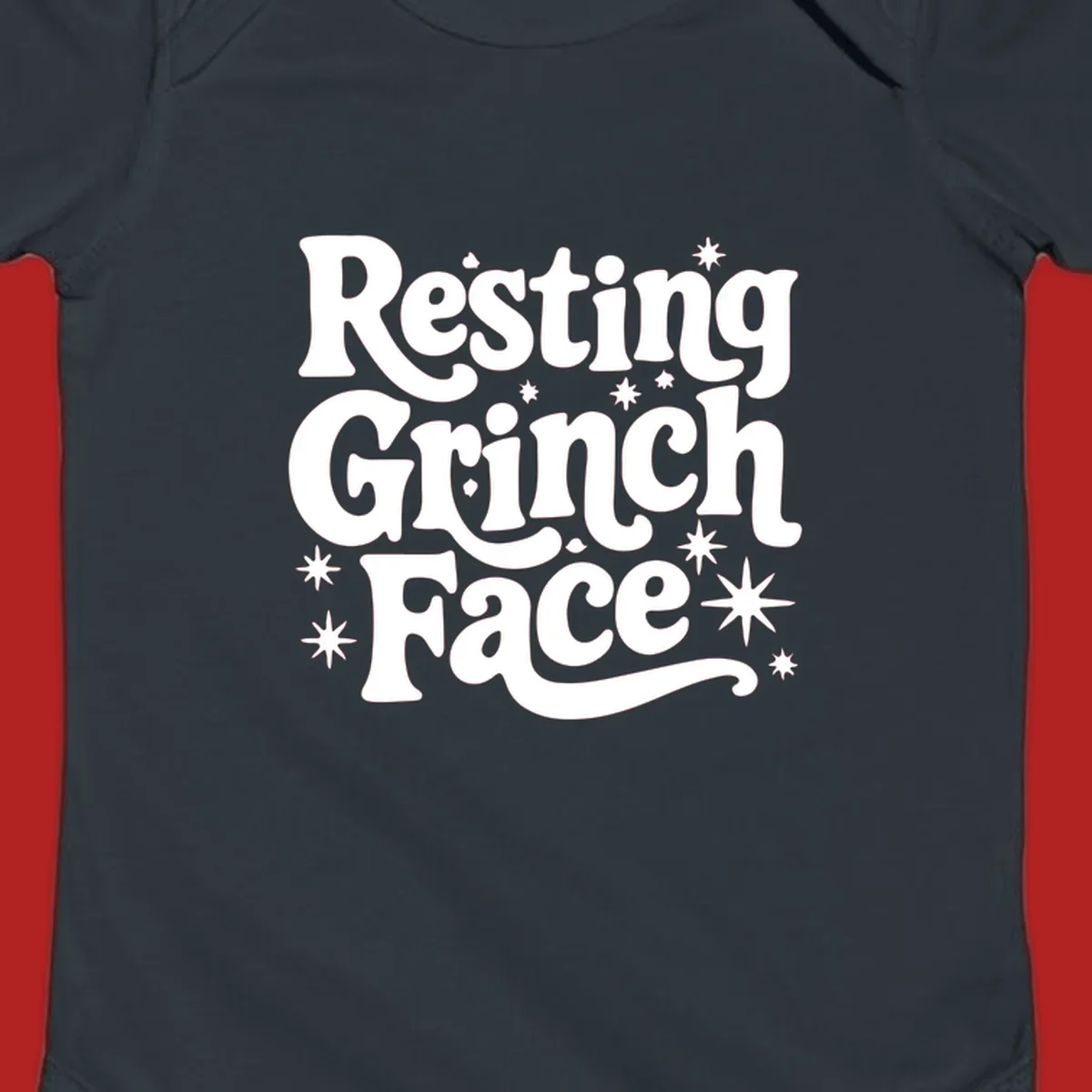 Resting Grinch Face text with stars, holiday design.