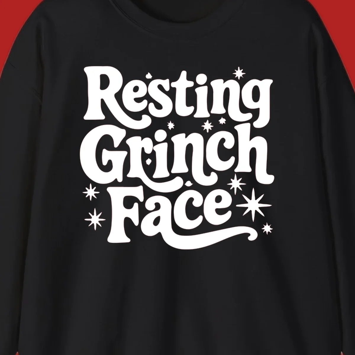 Resting Grinch Face text with stars, holiday design.