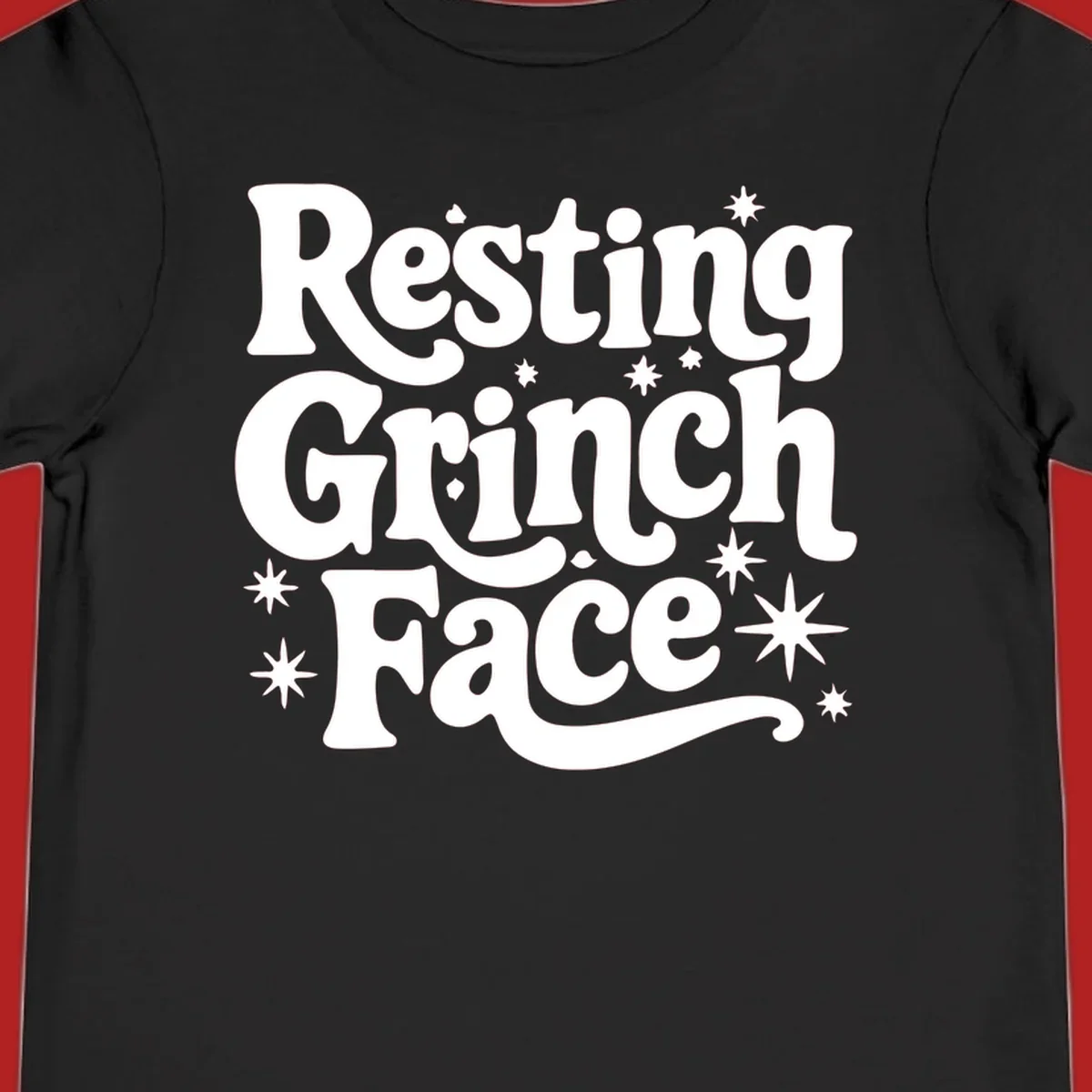 Resting Grinch Face text with stars, holiday design.