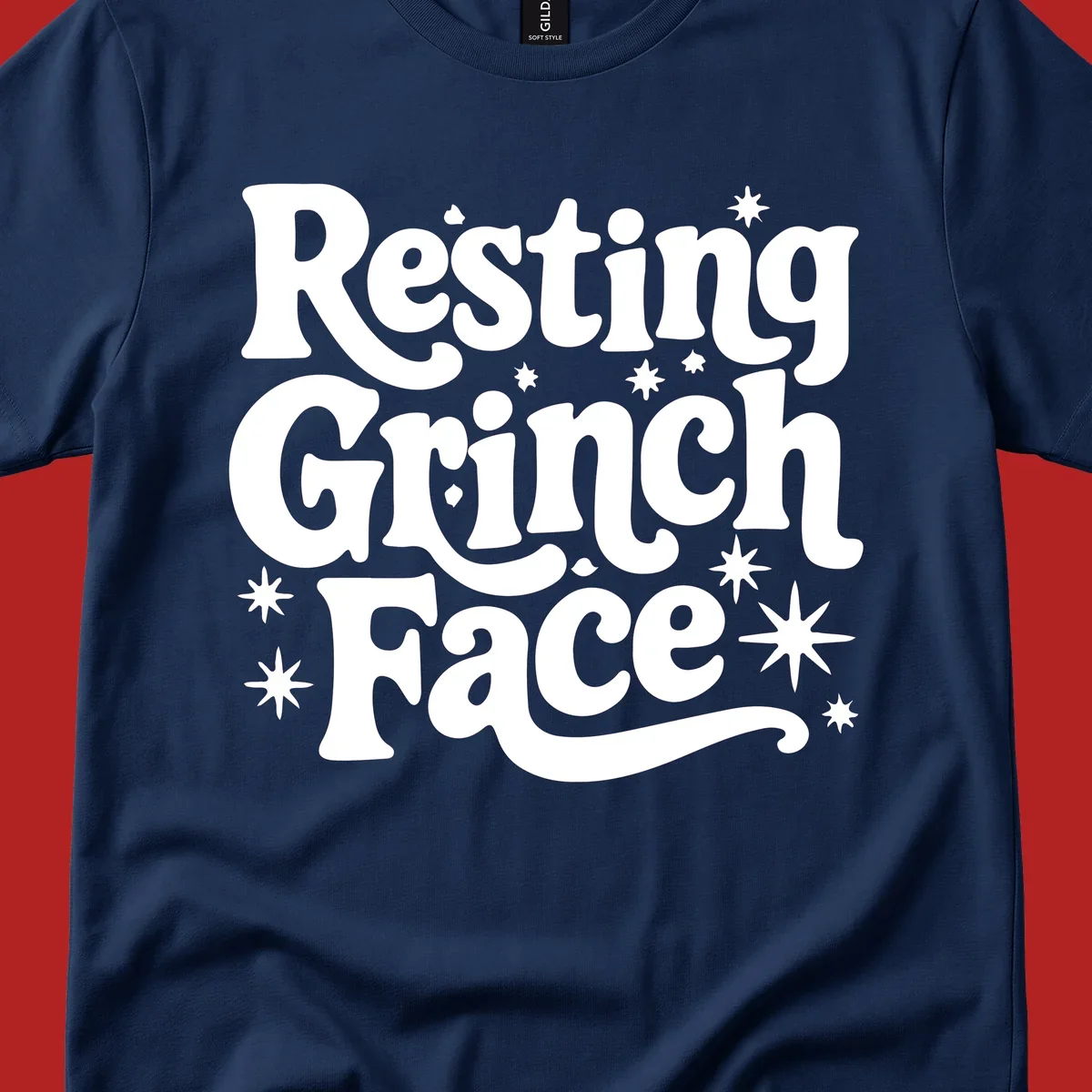 Resting Grinch Face text with stars, holiday design.