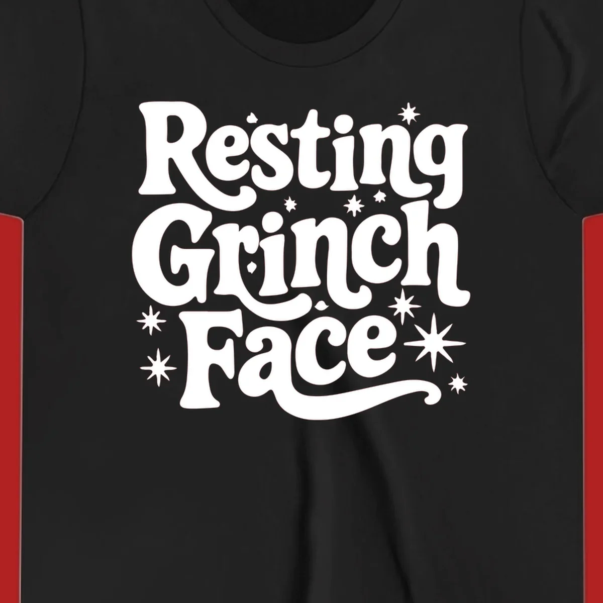 Resting Grinch Face text with stars, holiday design.