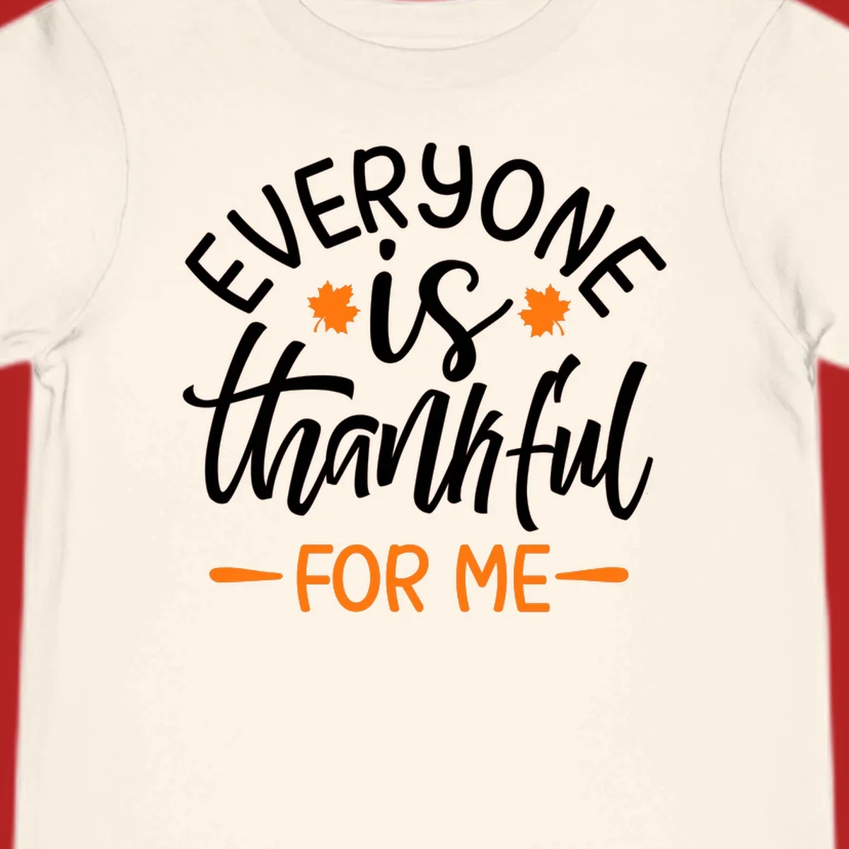 Typography design with text "EVERYONE is thankful FOR ME" and maple leaves, for Thanksgiving.