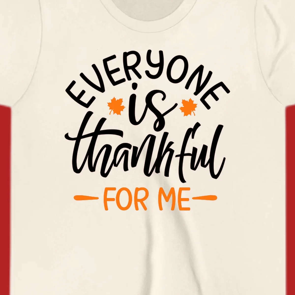 Typography design with text "EVERYONE is thankful FOR ME" and maple leaves, for Thanksgiving.