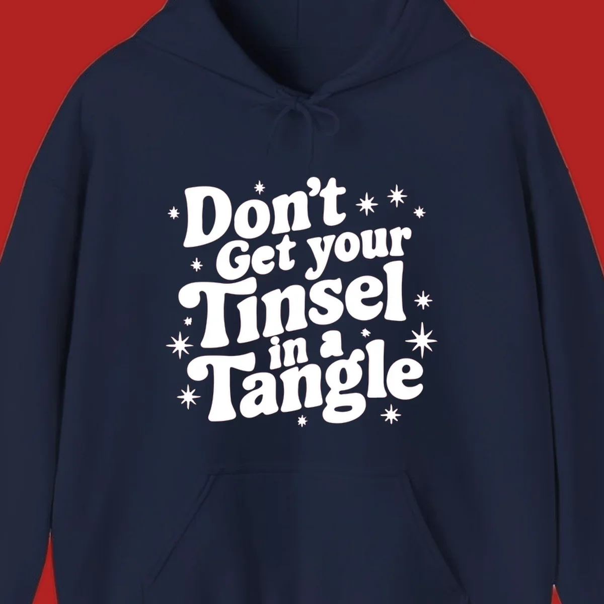 Don't get your tinsel in a tangle holiday text with stars, retro font.