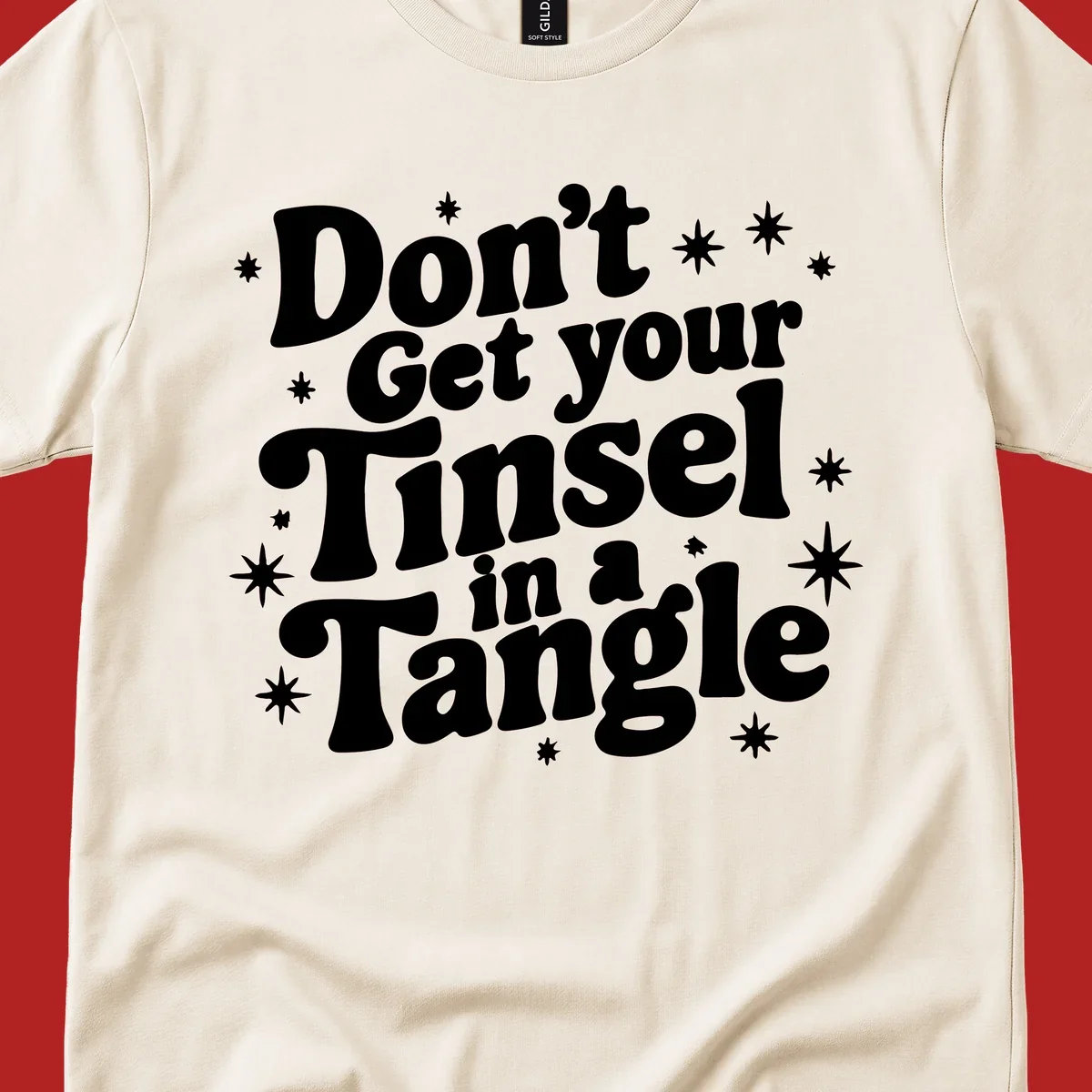 Don't get your tinsel in a tangle holiday text with stars, retro font.