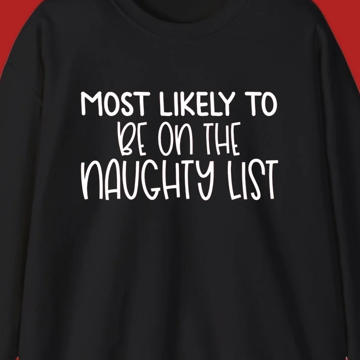 White text on black background reading 'MOST LIKELY TO BE ON THE NAUGHTY LIST', for the naughty list Christmas concept.